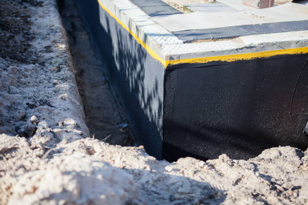 Professional Basement Waterproofing technician working in North Vernon, IN
